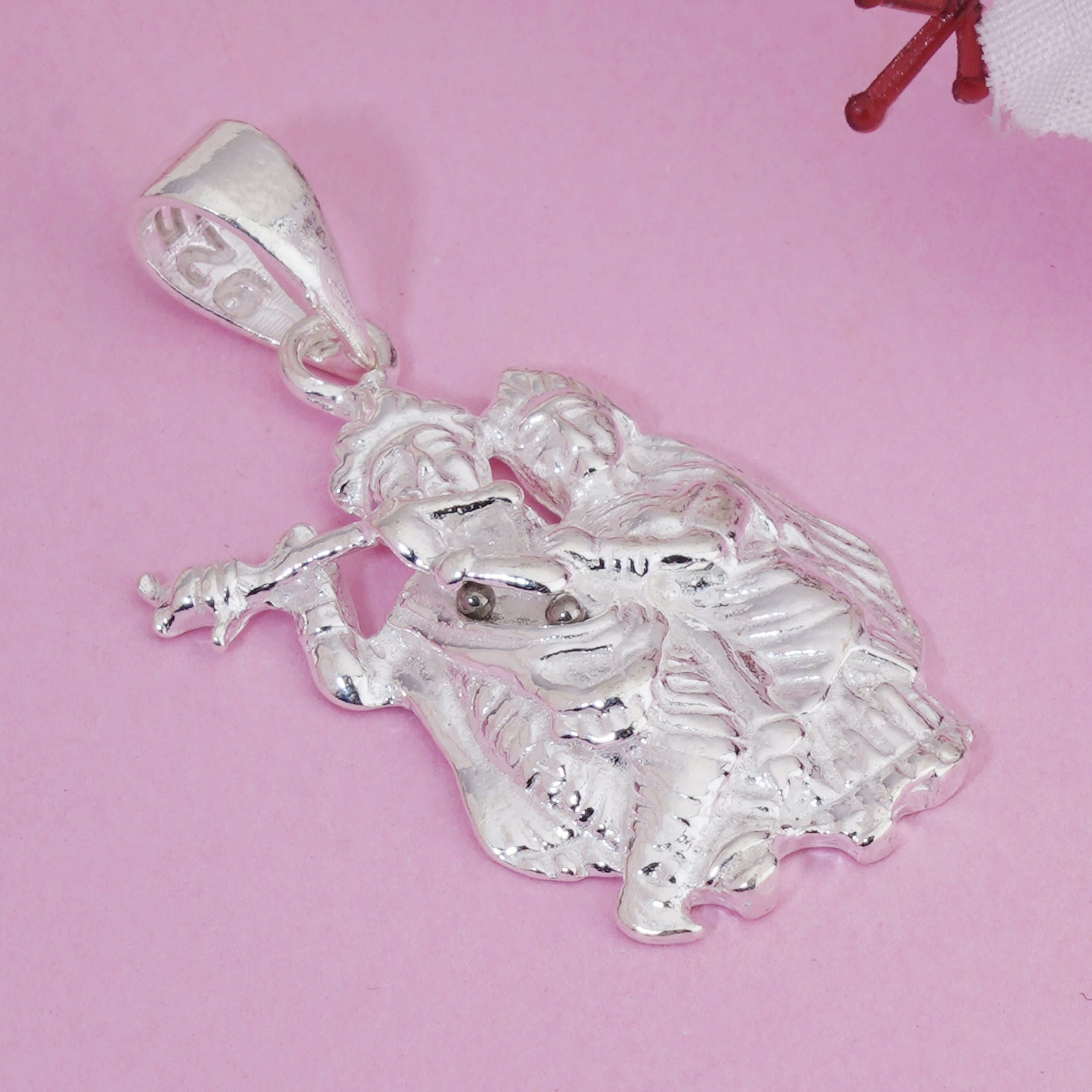 925 silver pendant with intricate Radha Krishna design, blending spirituality with elegance.