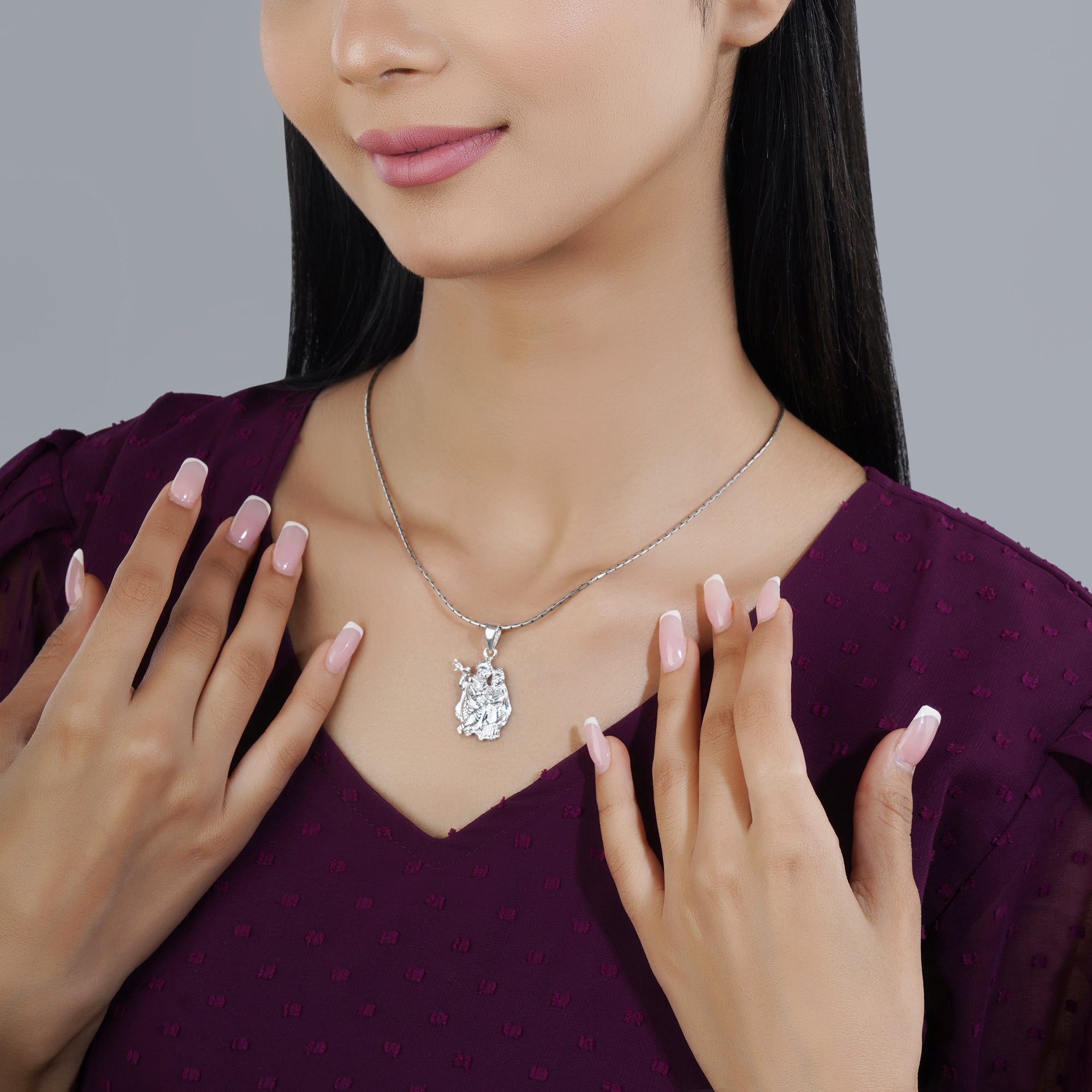 925 silver pendant with intricate Radha Krishna design, blending spirituality with elegance.