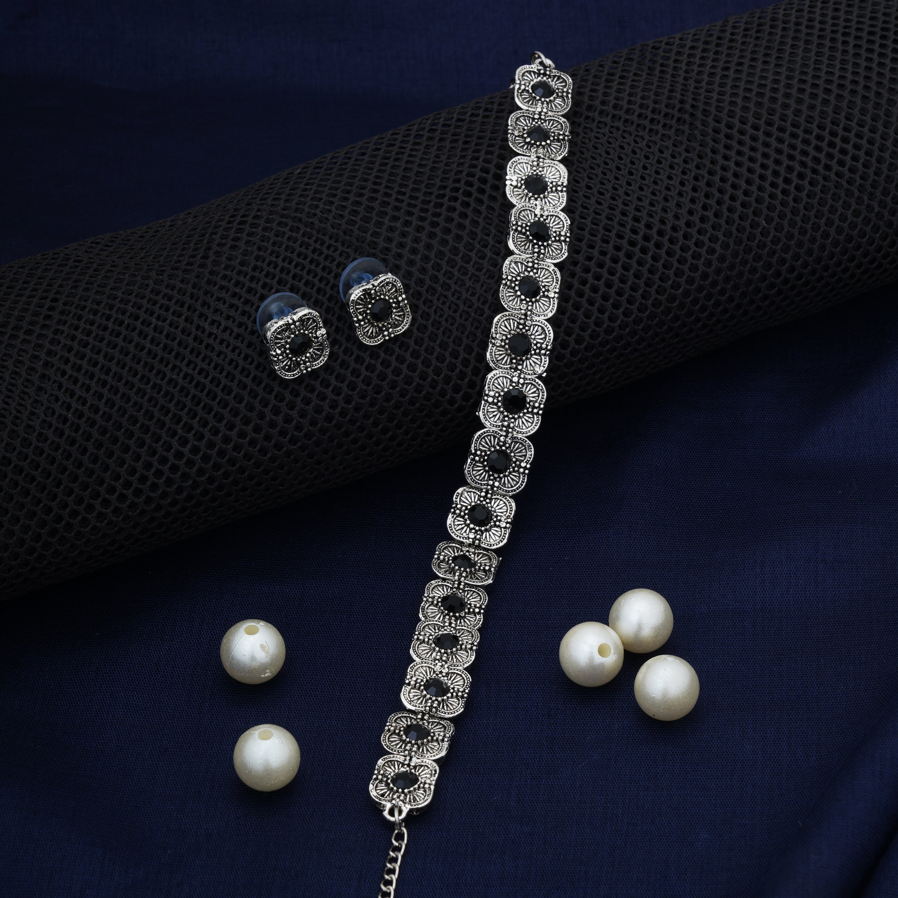 Floral design oxidized choker set with matching earrings, perfect for festive elegance.