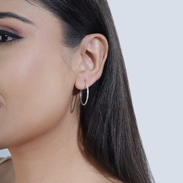 Sleek 925 silver hoop earrings with a stylish ring design, adding modern elegance to any outfit.