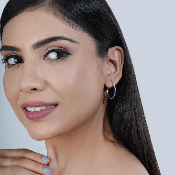 Sleek 925 silver hoop earrings with a stylish ring design, adding modern elegance to any outfit.