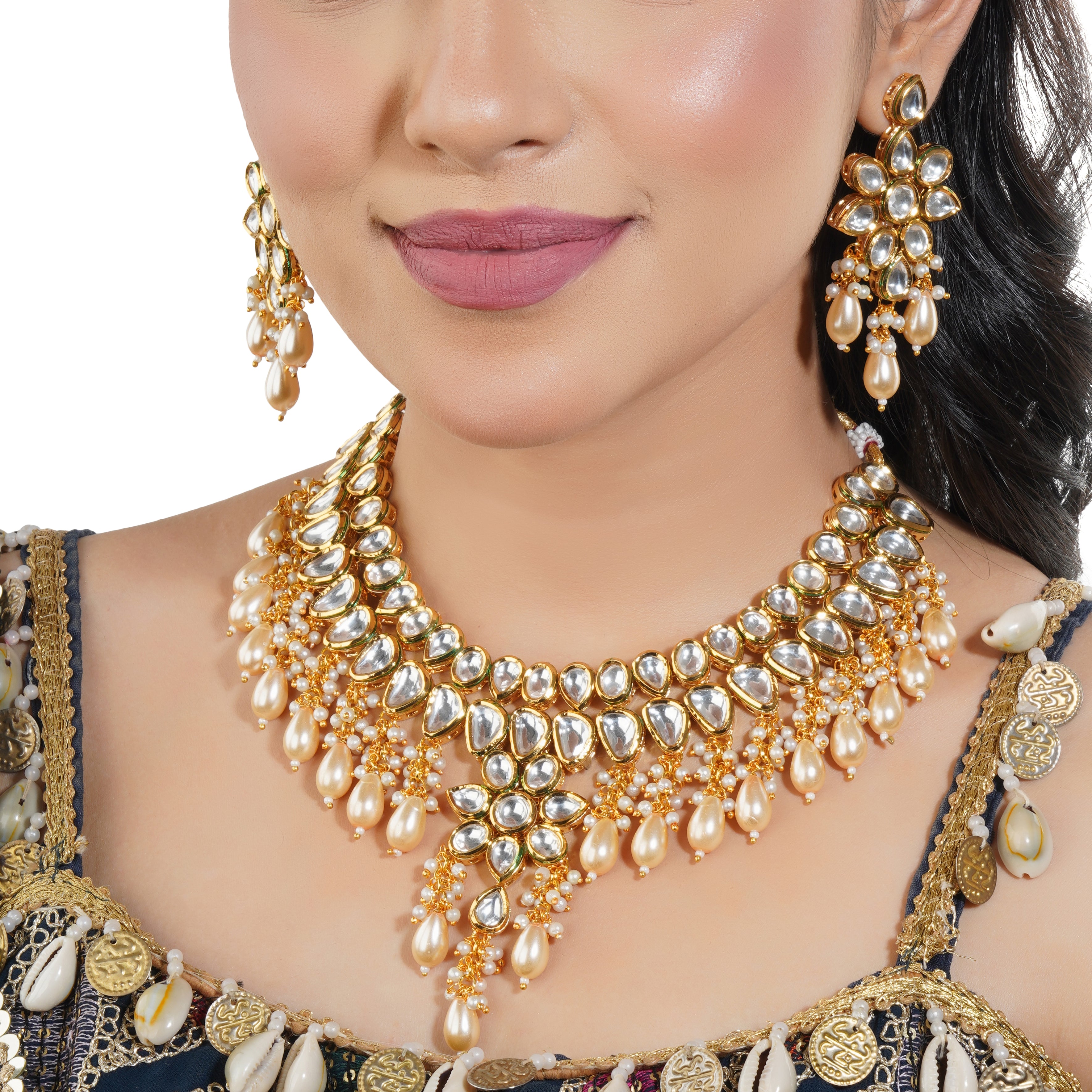 Stunning Kundan choker necklace set with intricate pearl embellishments and craftsmanship.