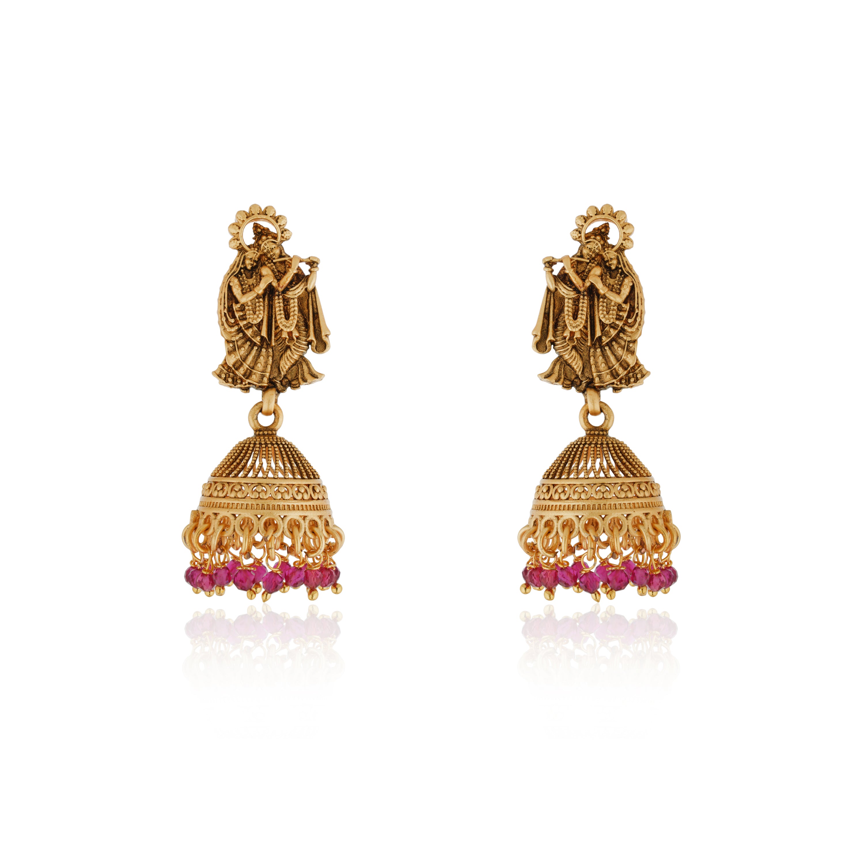 Radha Krishna temple necklace set with red pearls, showcasing intricate gold-tone craftsmanship.