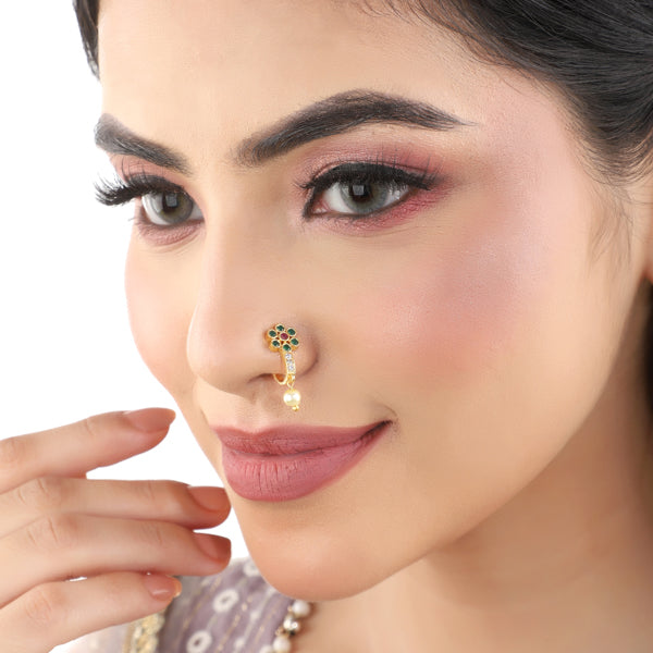 Kundan-studded goldtone nosepin with intricate detailing and a classic goldtone finish.