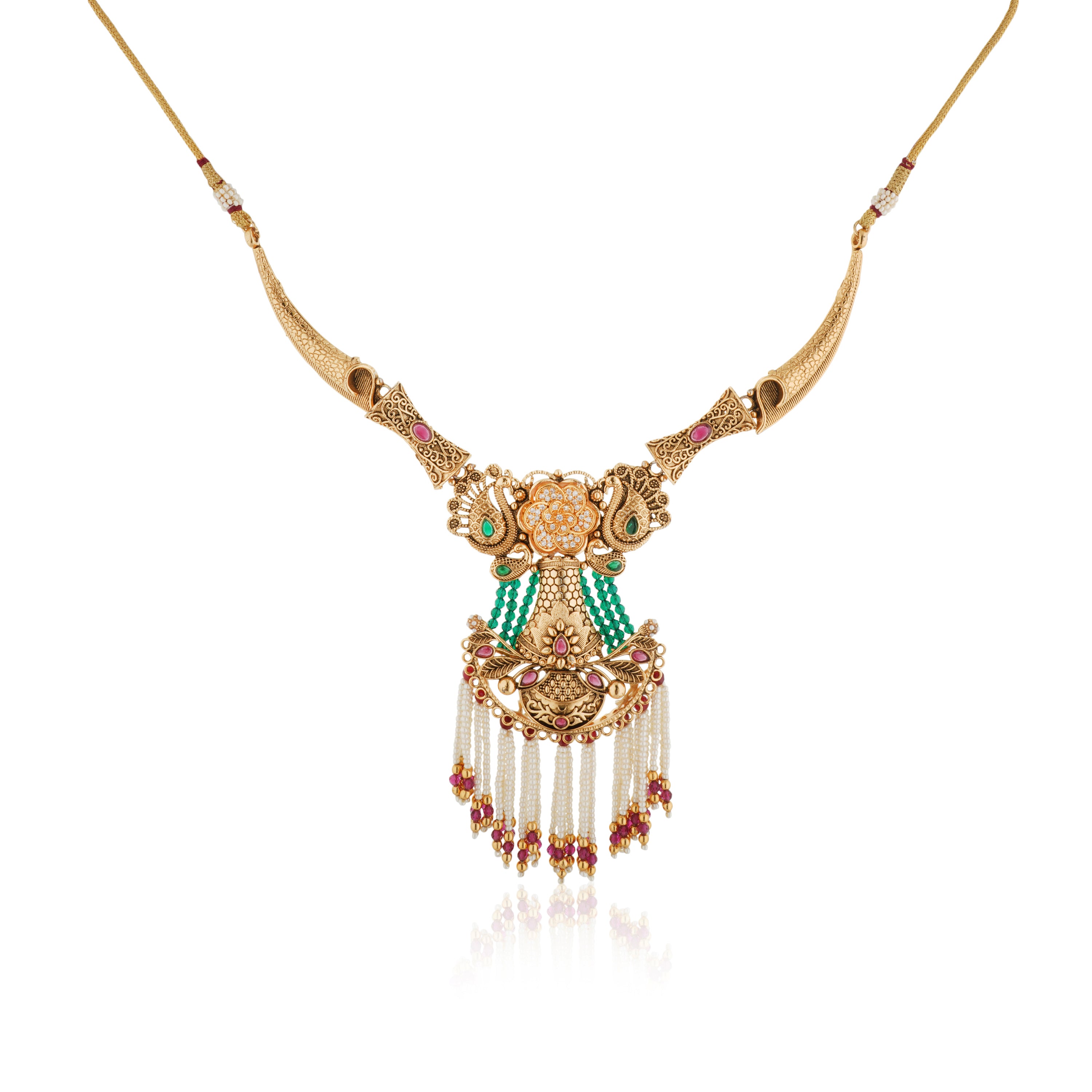 Graceful gold-tone long necklace adorned with pearls, blending tradition with sophistication.