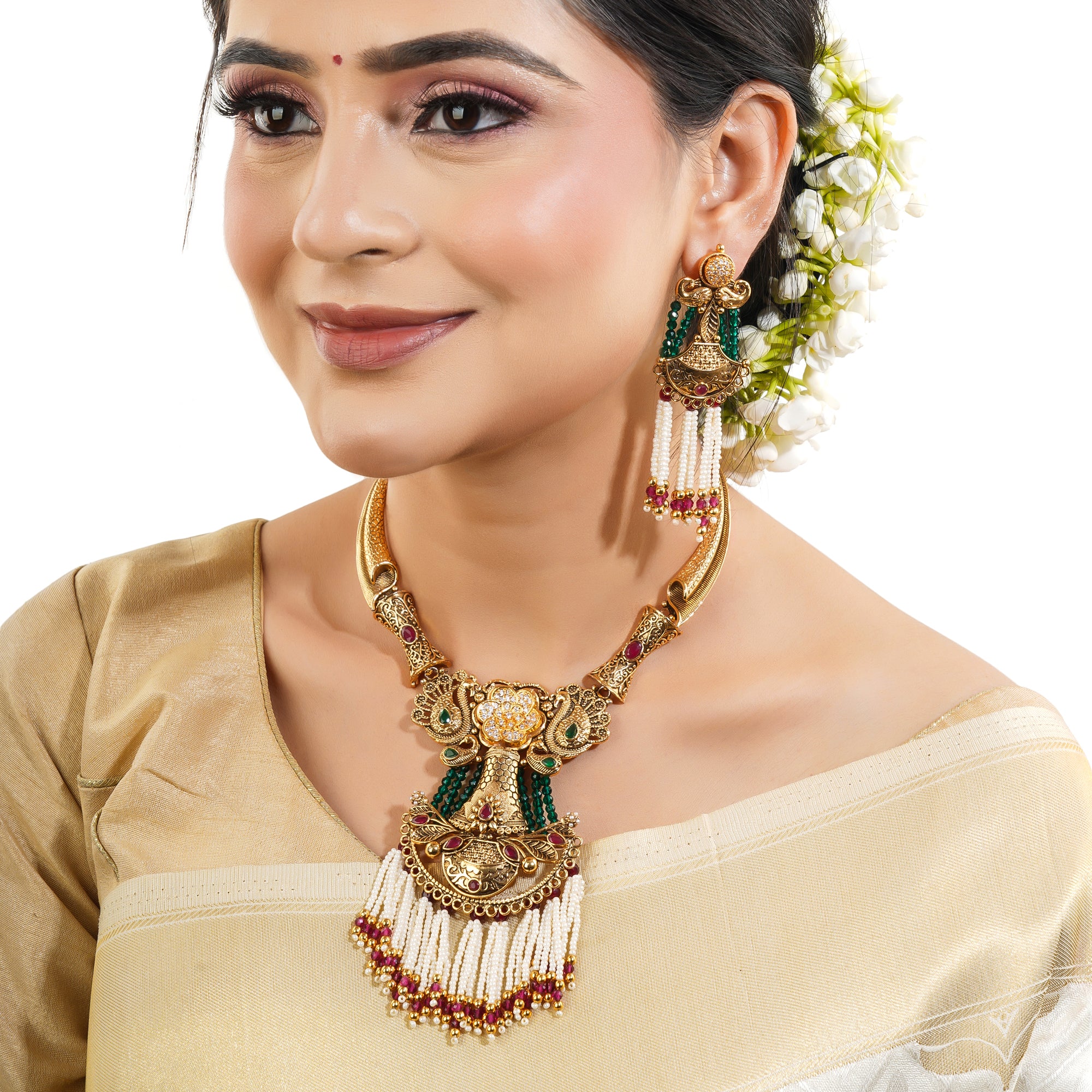 Graceful gold-tone long necklace adorned with pearls, blending tradition with sophistication.