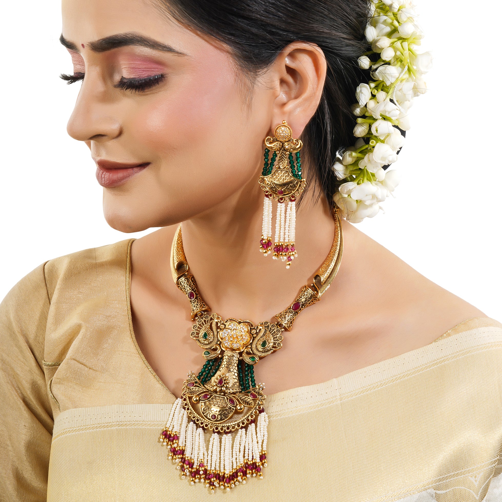 Graceful gold-tone long necklace adorned with pearls, blending tradition with sophistication.