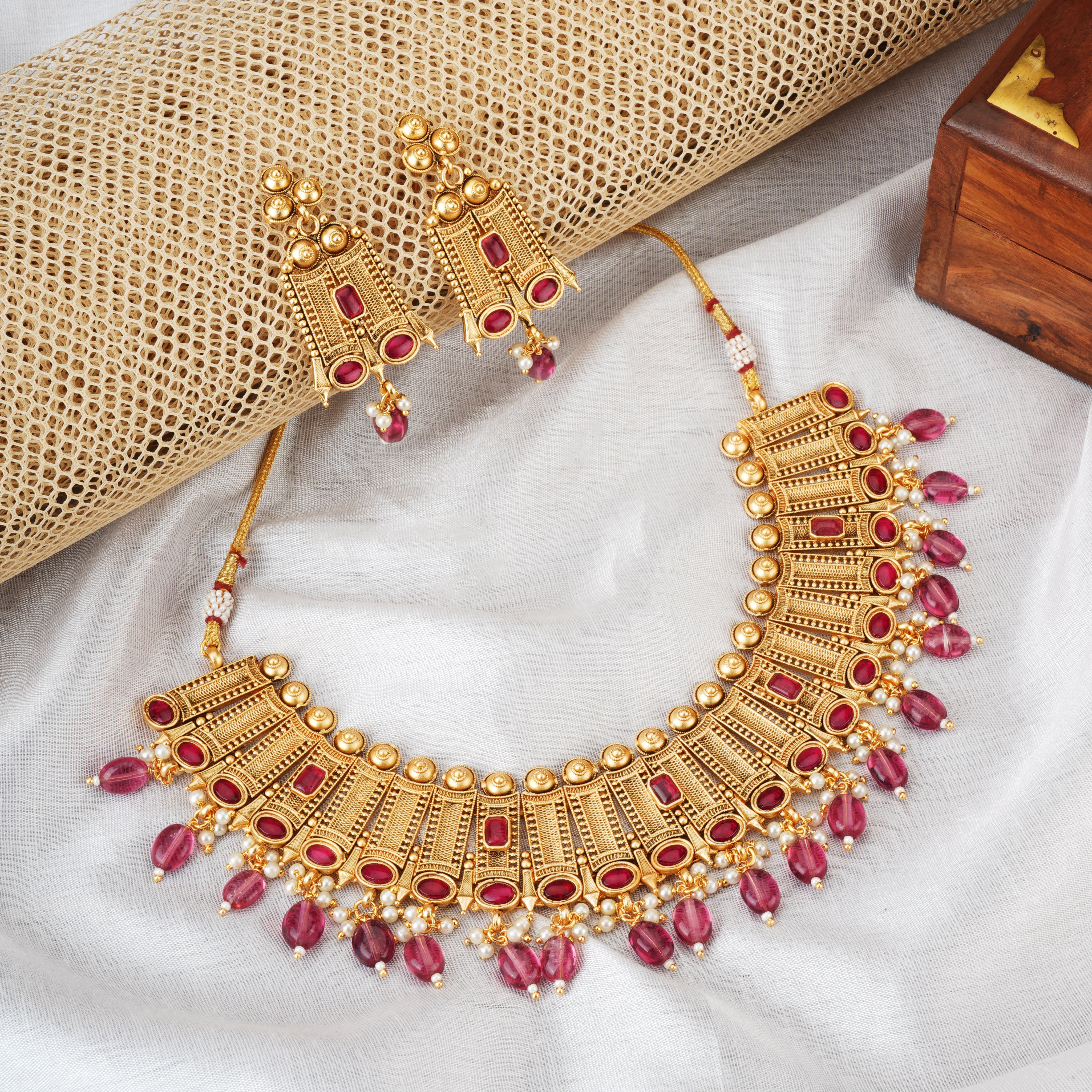 Elegant gold-tone choker necklace set with matching earrings, perfect for festive occasions