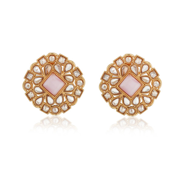"Kundan-studded earrings with matching maang tika, a timeless set for a classic festive look."