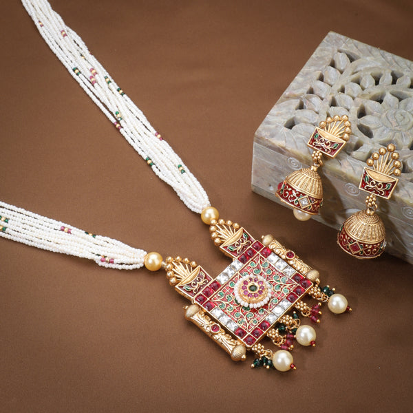 "Graceful gold-tone long necklace with small white pearls, perfect for a sophisticated festive style."