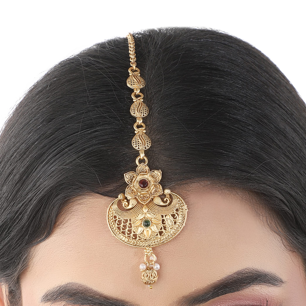 Traditional gold-tone maang tika with a golden finish, ideal for festive and elegant hairstyles.