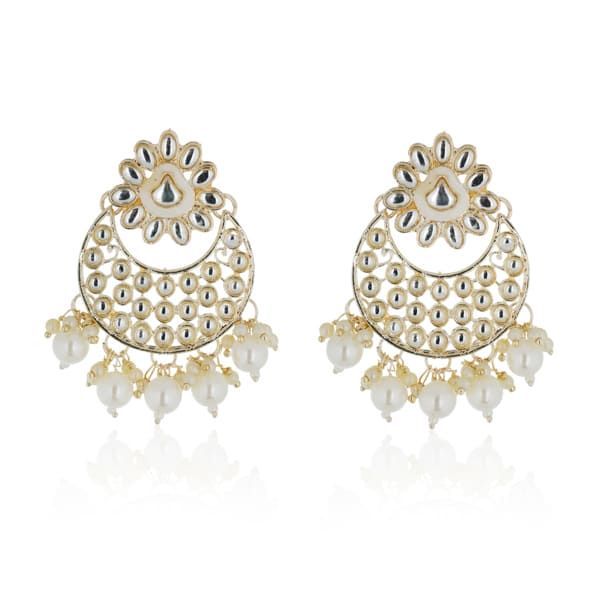 "Classic silver Kundan and pearl-studded earrings with matching Maang Tikka for festive elegance."