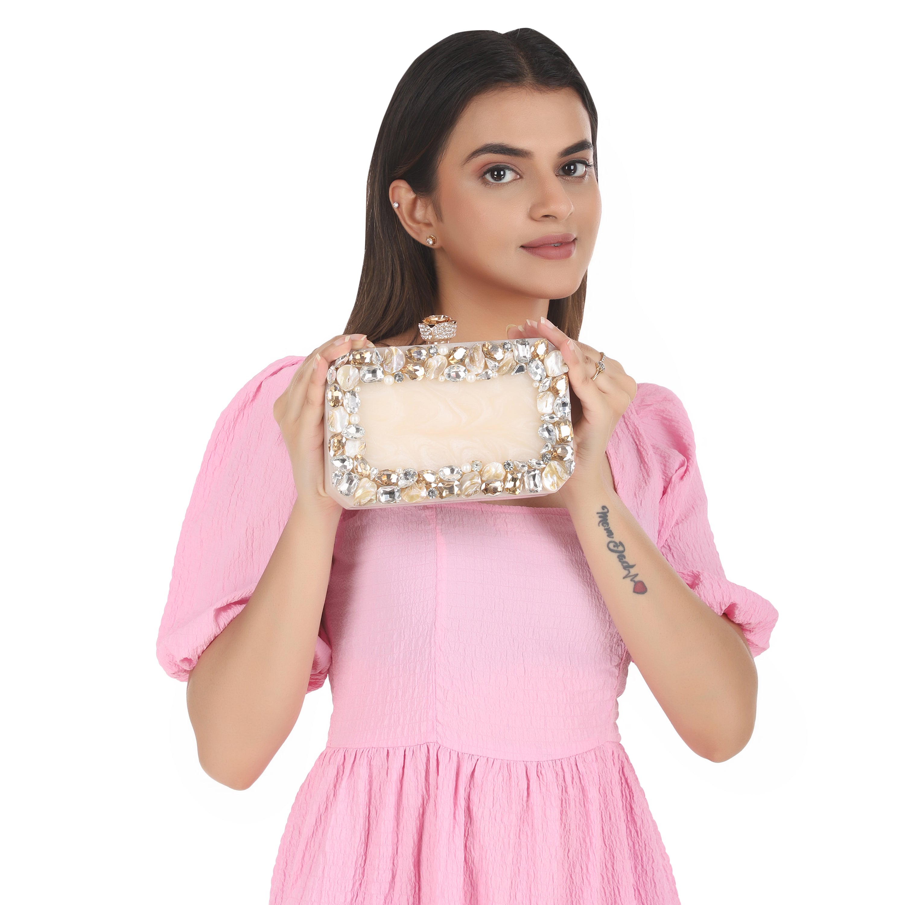 Resin-embellished salmon clutch with rose knob, sturdy sling, and extra pocket for convenience.