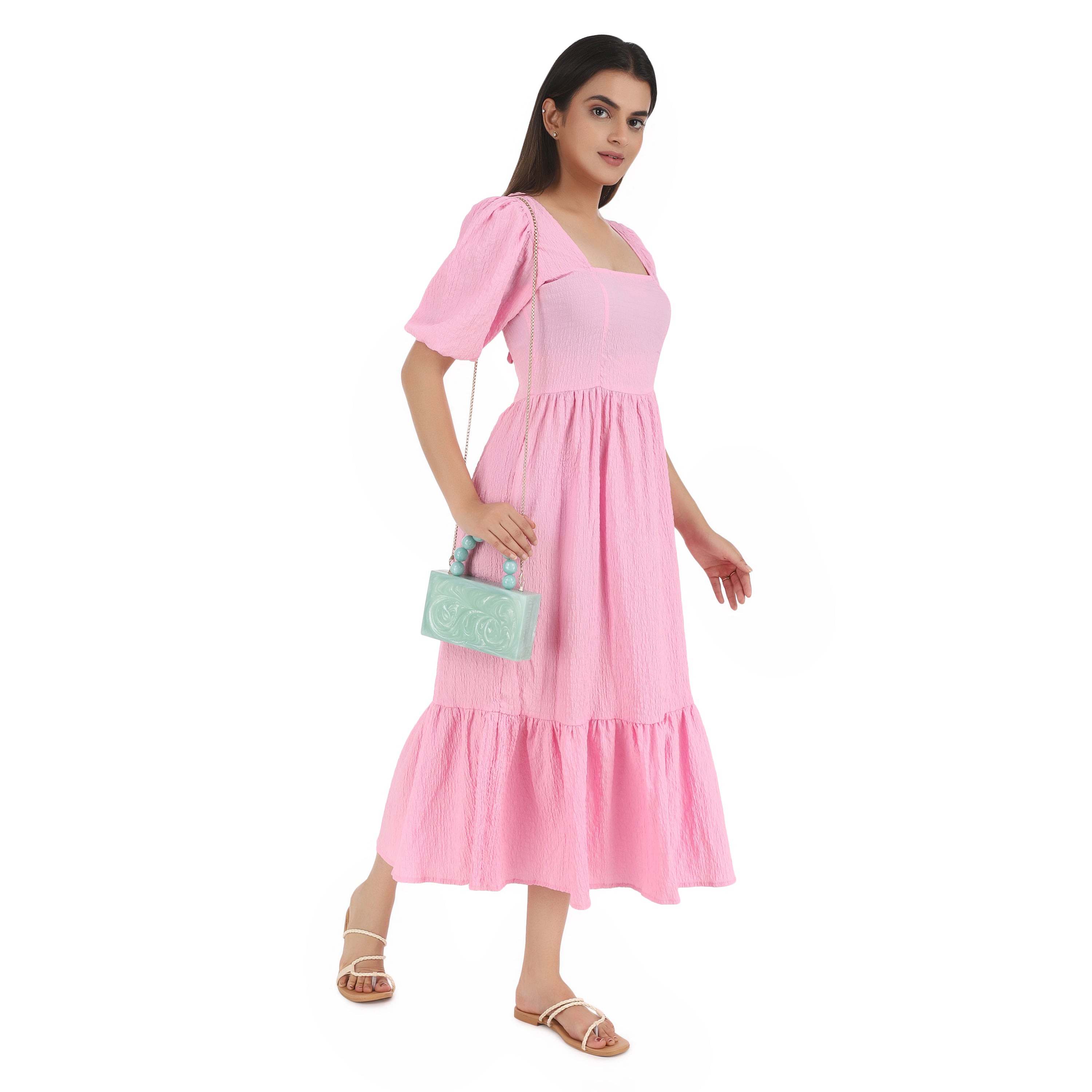 Green resin clutch with velvet lining, heavy-duty sling, and extra pocket for stylish storage.