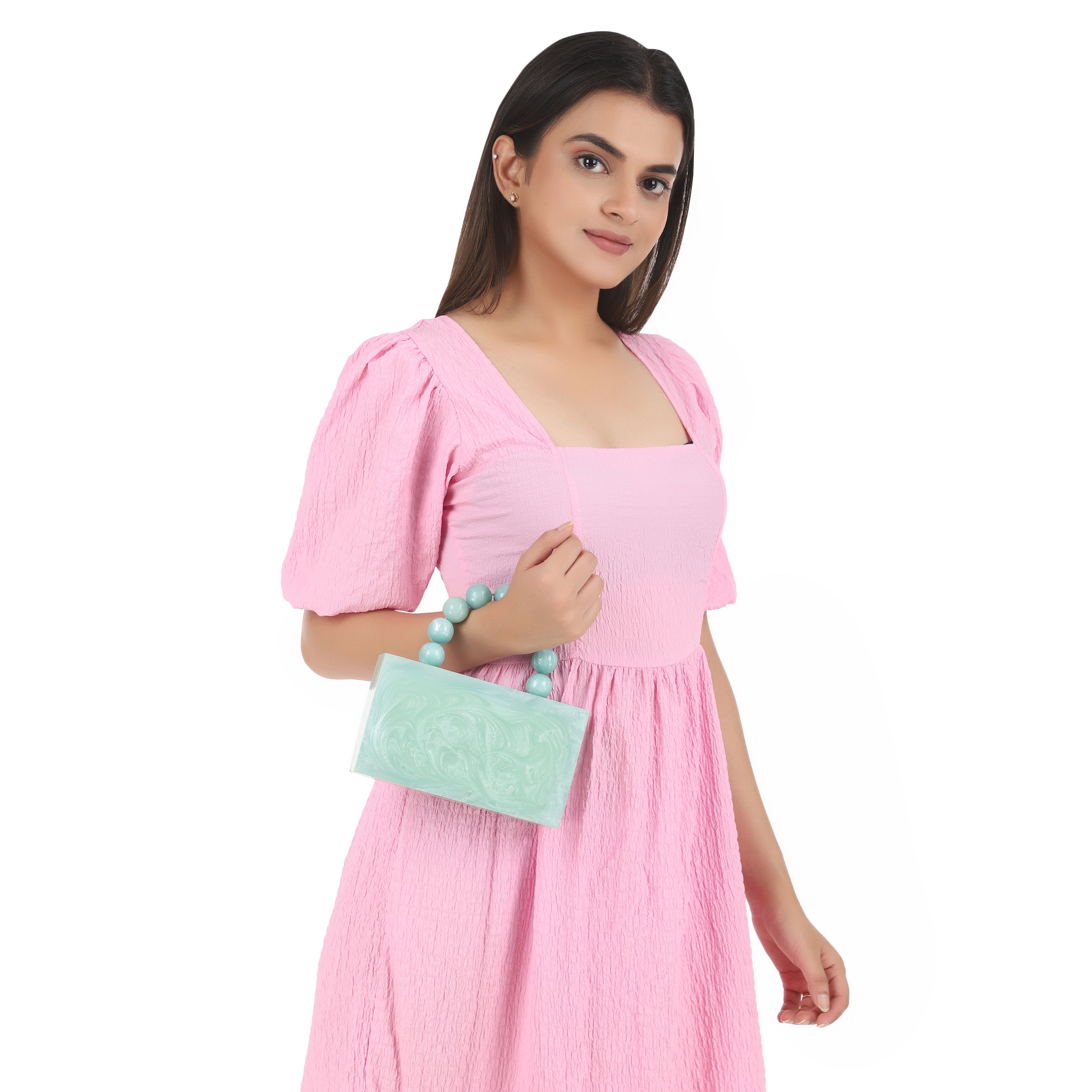 Green resin clutch with velvet lining, heavy-duty sling, and extra pocket for stylish storage.