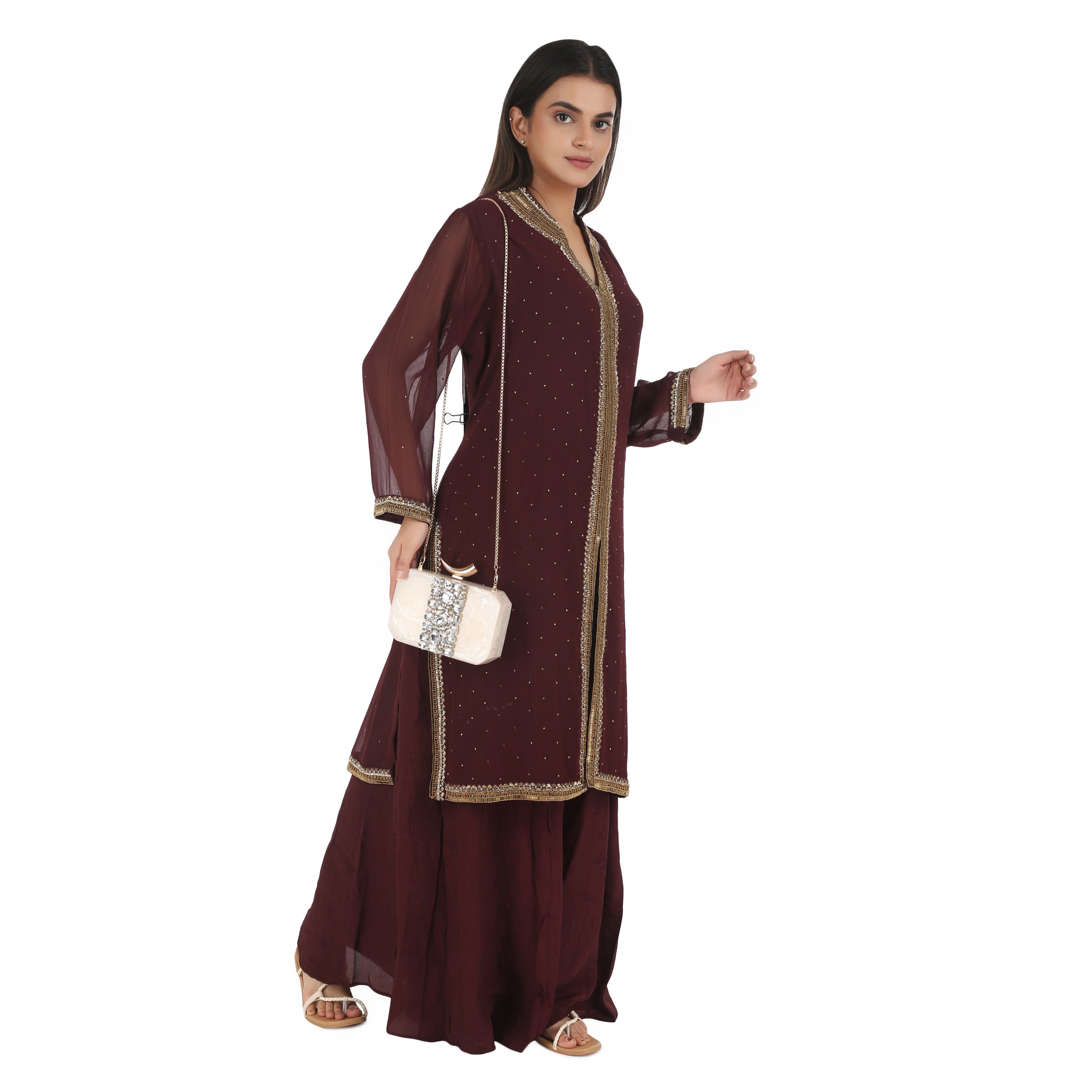 Salmon resin clutch with stone embellishments, soft lining, and extra pocket for practical storage.