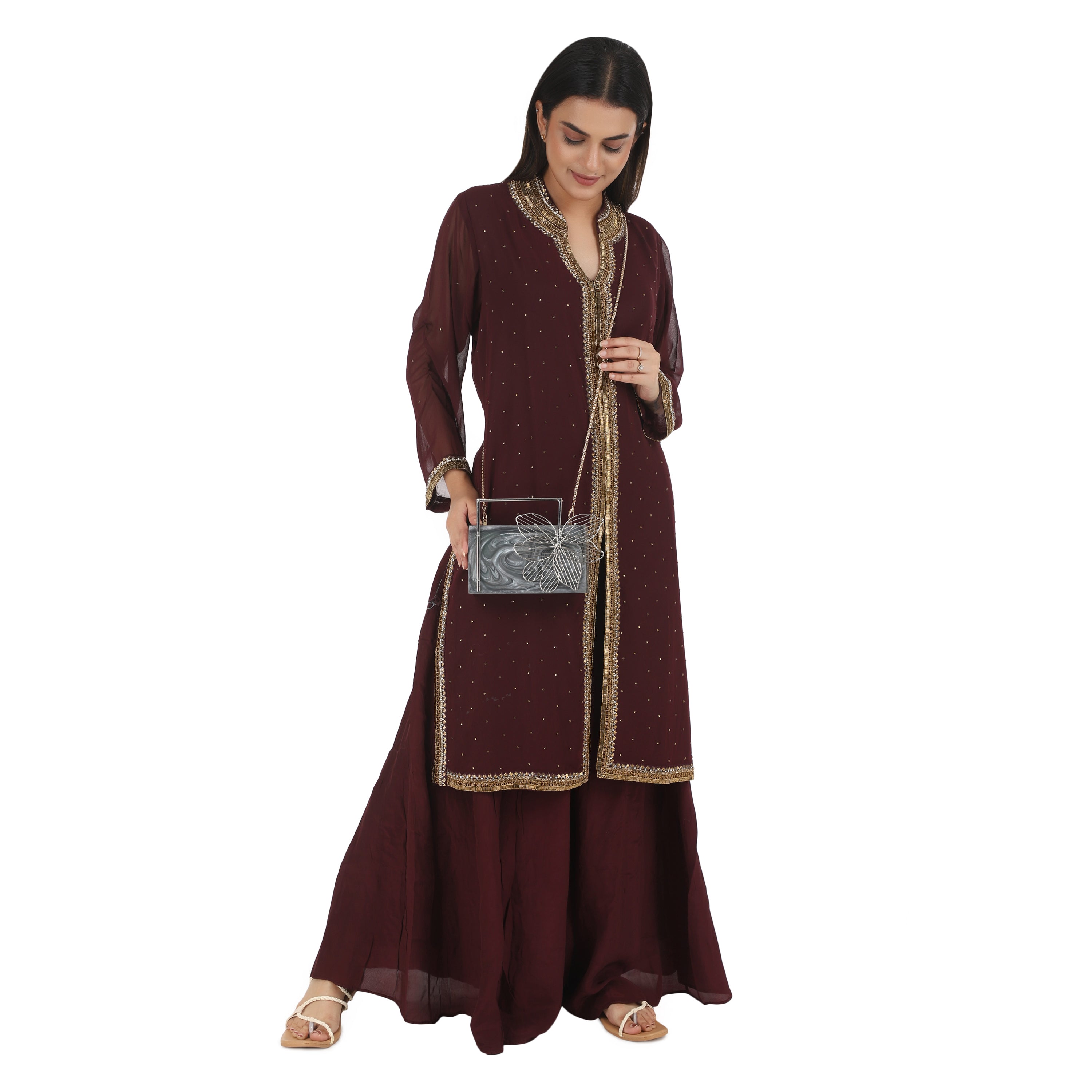 Exclusive grey resin clutch with flower handles, heavy sling, and extra pocket for practicality.