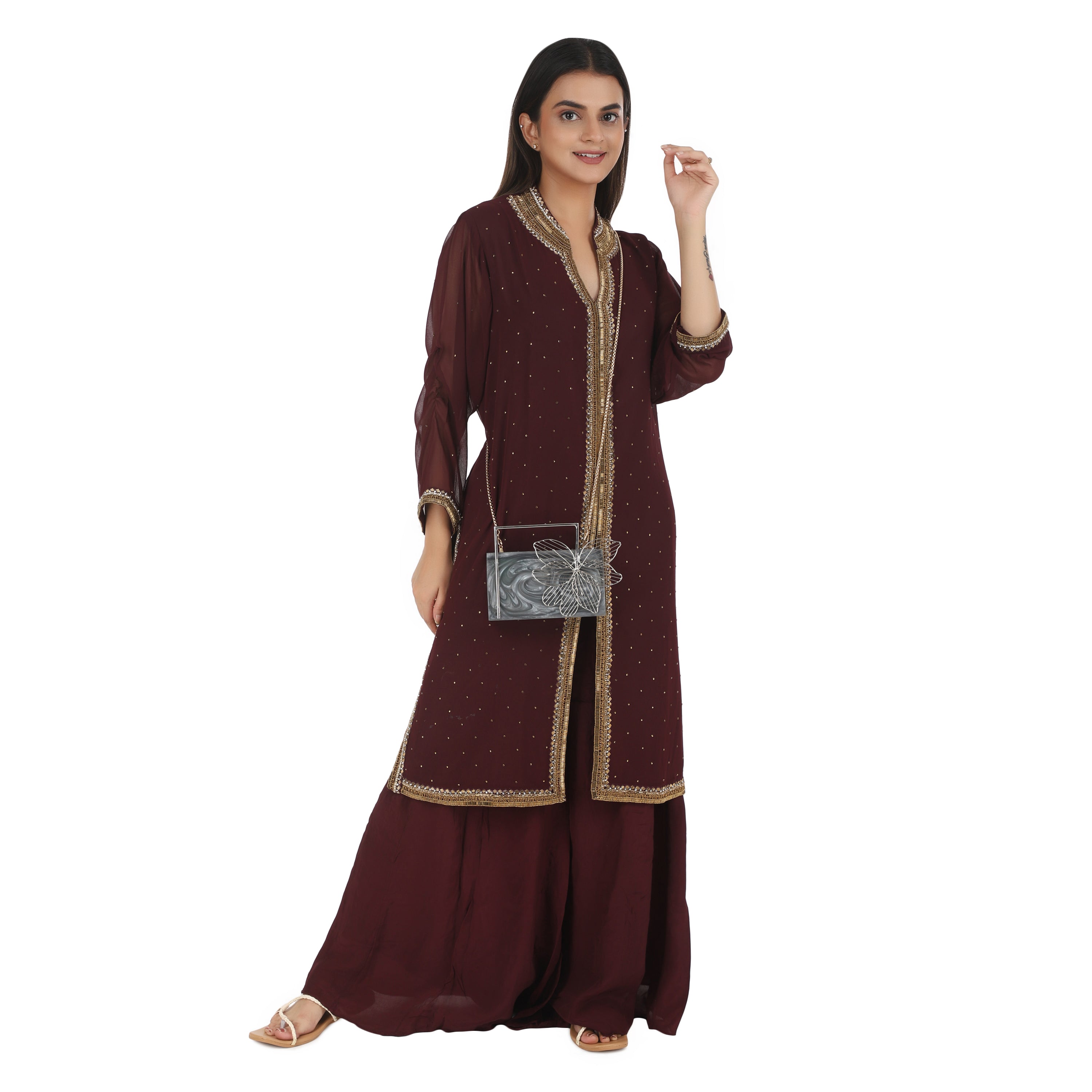 Exclusive grey resin clutch with flower handles, heavy sling, and extra pocket for practicality.