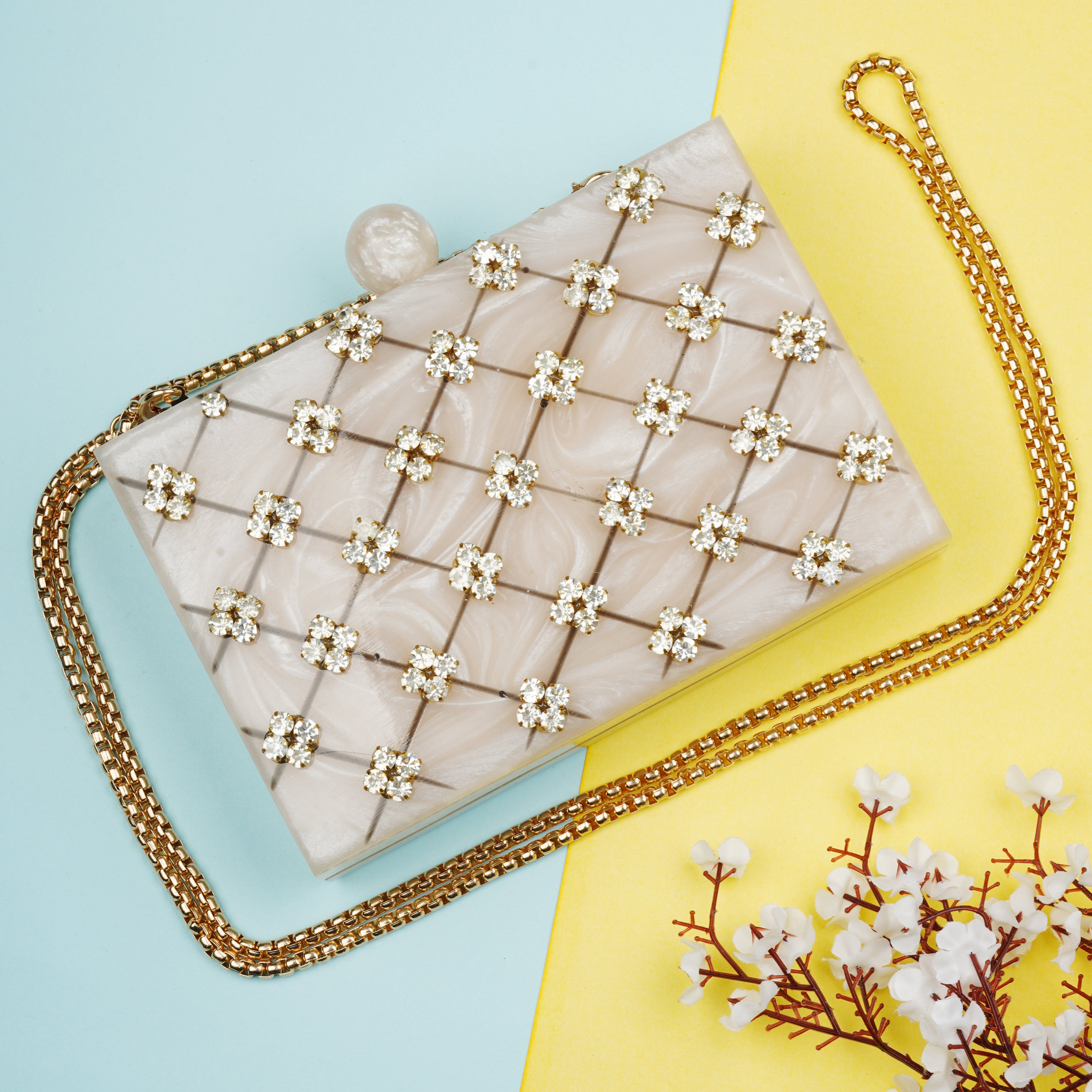 Beautifully crafted salmon resin clutch with exquisite details, perfect for showcasing your style.