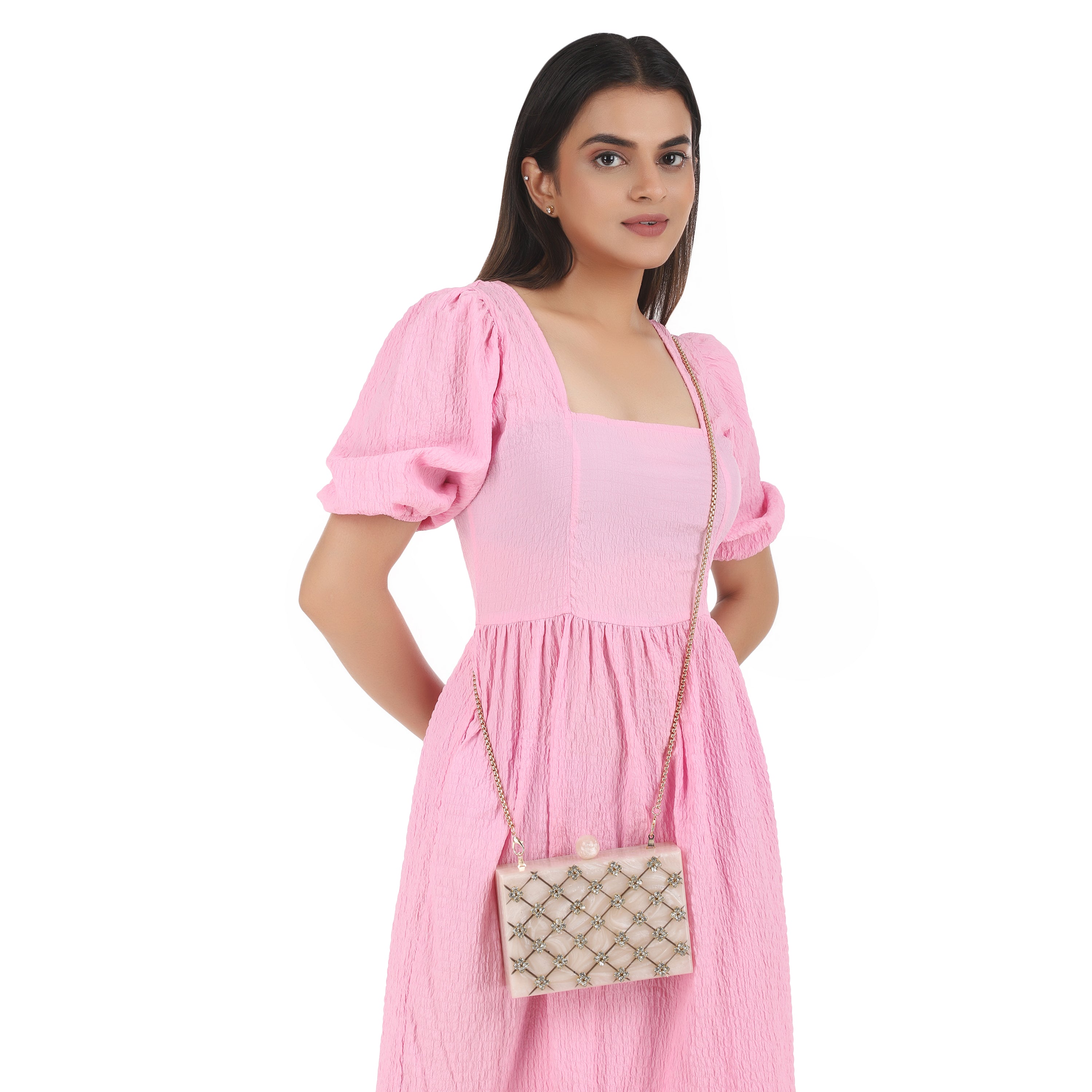 Beautifully crafted salmon resin clutch with exquisite details, perfect for showcasing your style.