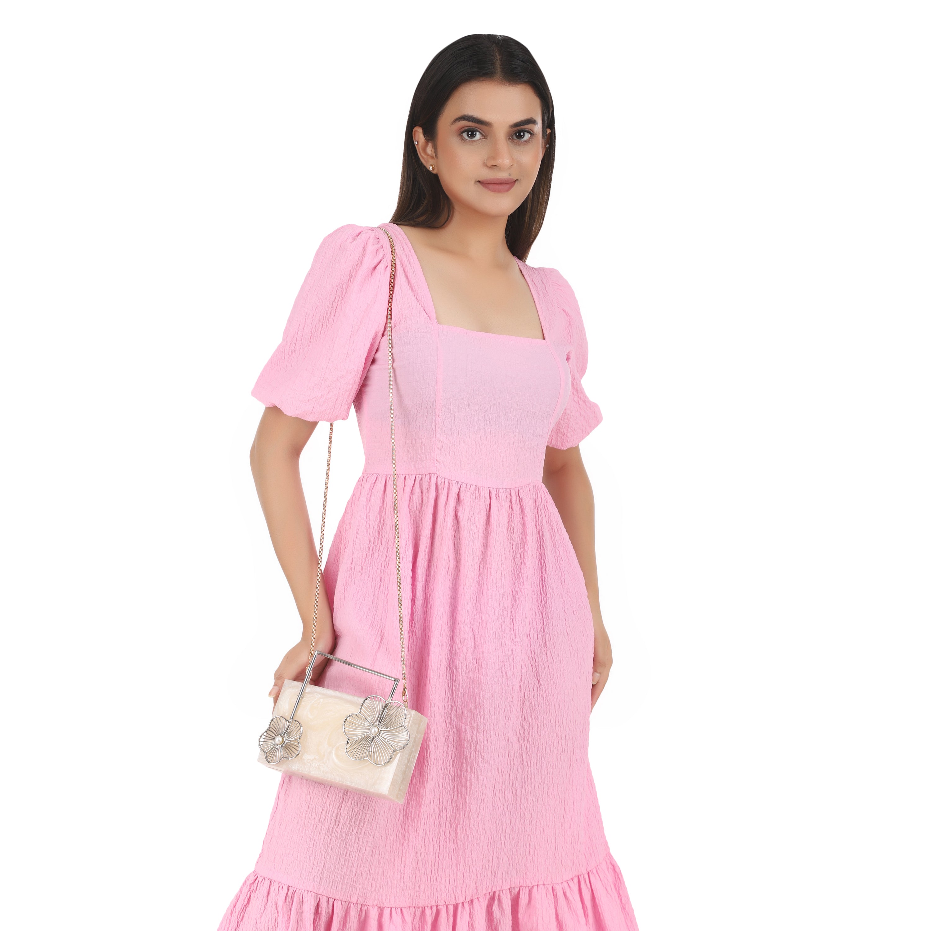 Salmon resin clutch with unique flower handles, heavy sling, and extra pocket for convenience.