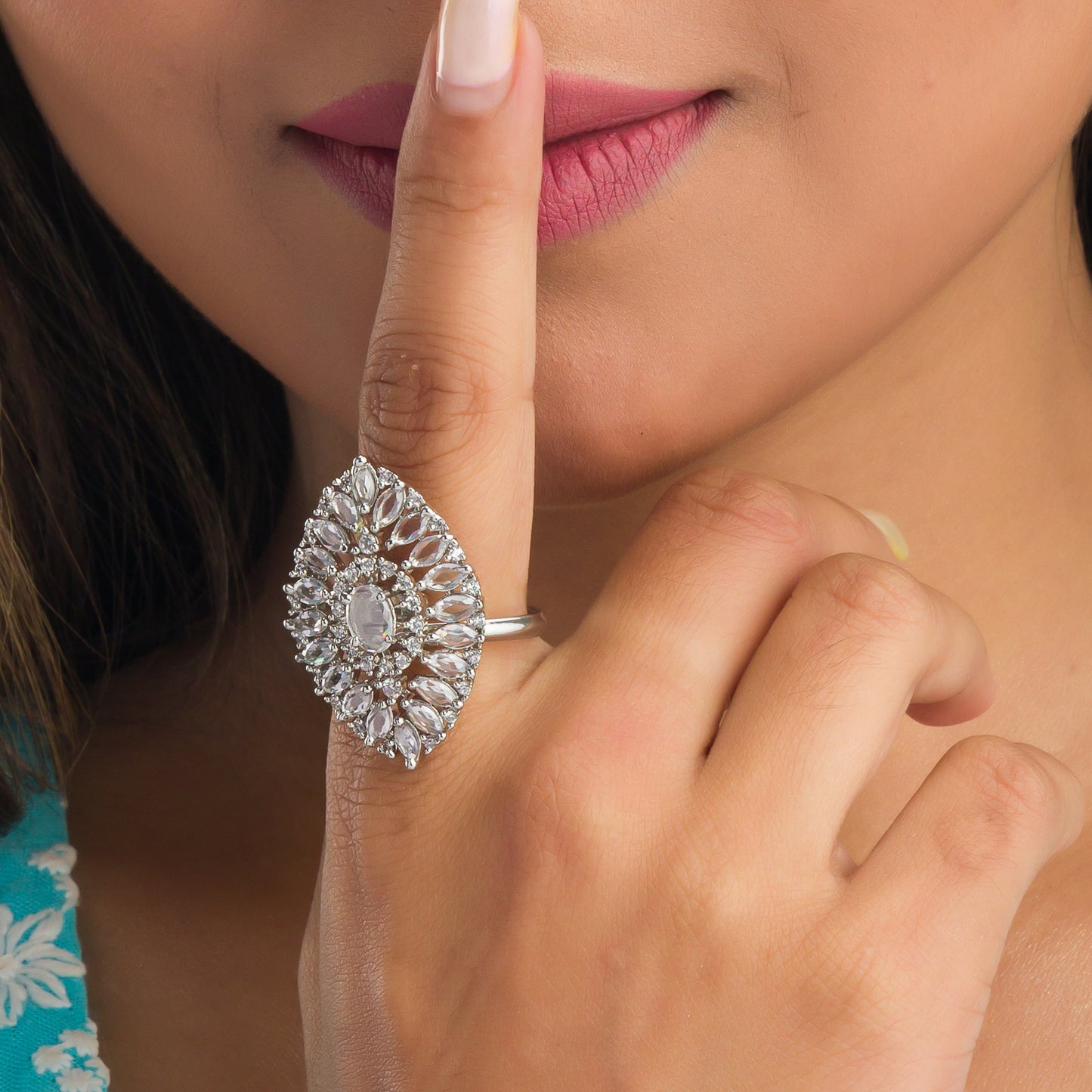 A SILVER ZIRCON FINGER RING OFFERS A SLEEK, MODERN LOOK WITH SPARKLING ELEGANCE.