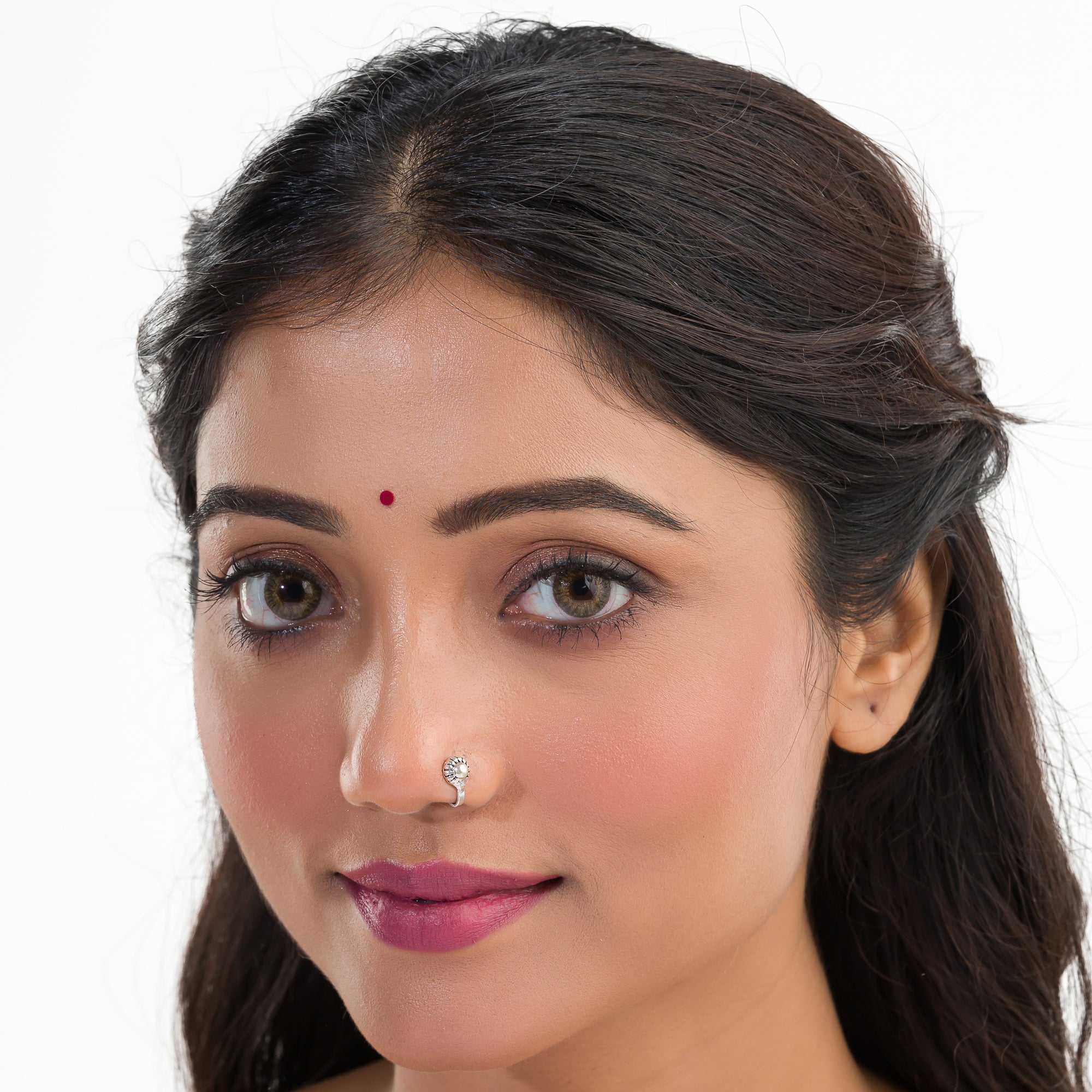 "Chic oxidized silver nose pin for festival wear, offering a subtle, retro charm with dark finish."
