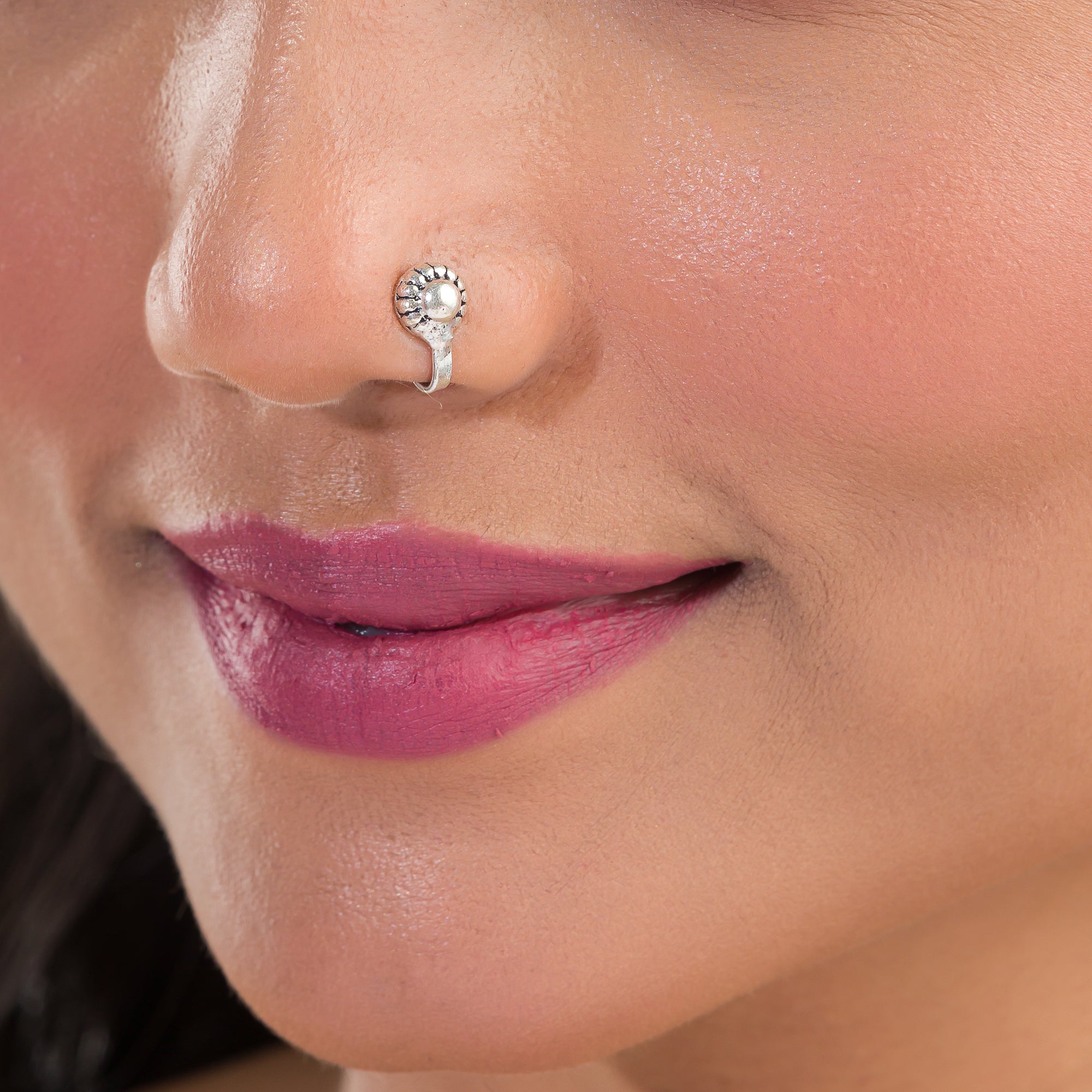 "Chic oxidized silver nose pin for festival wear, offering a subtle, retro charm with dark finish."
