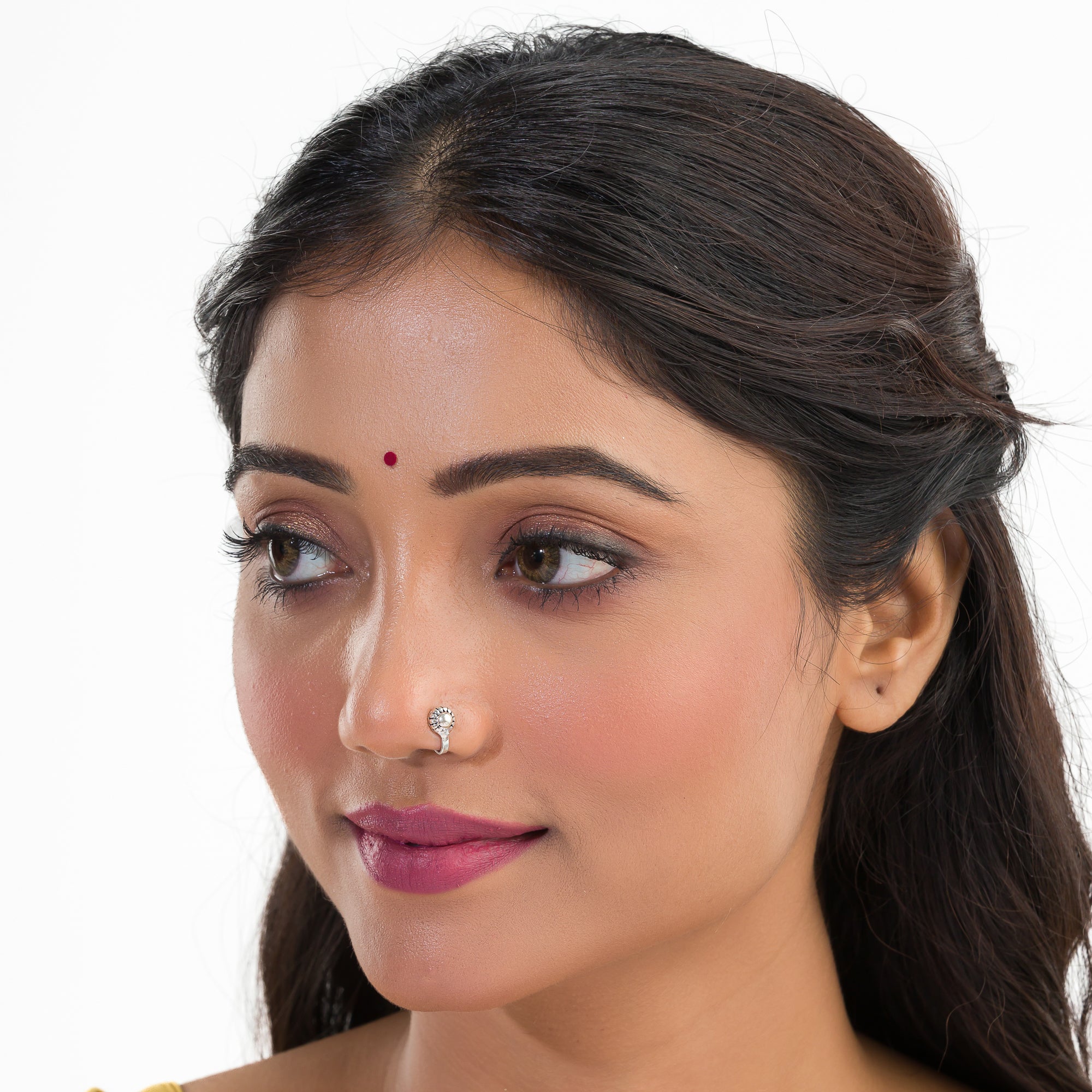 "Chic oxidized silver nose pin for festival wear, offering a subtle, retro charm with dark finish."
