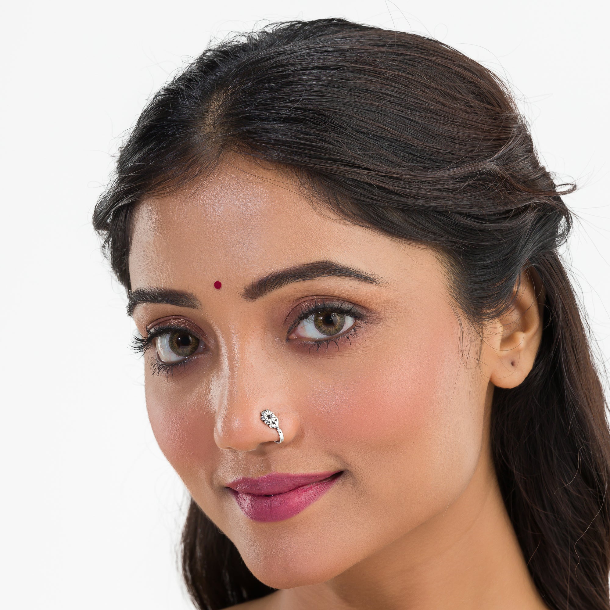 "Elegant oxidized silver nose pin, ideal for festival wear, with a delicate vintage-inspired look."
