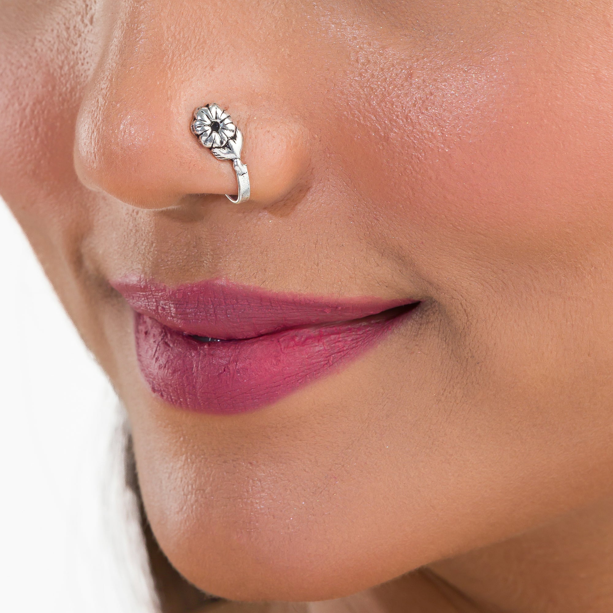 "Elegant oxidized silver nose pin, ideal for festival wear, with a delicate vintage-inspired look."
