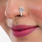 "Refined oxidized silver nose pin for festival wear, adding a retro touch with its darkened finish."
