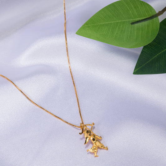 GOLD-TONE PENDANT OF A BOY WITH A BOW (DHANUSH).