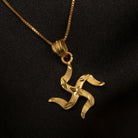 Elegant gold-tone pendant with a Swastik design, perfect for casual wear, adding a meaningful touch."
