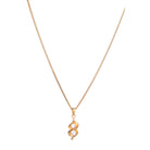 Gold-tone pendant in infinity shape with two stones, perfect for casual wear, adding elegance
