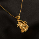 "Gold-tone pendant set featuring Shivji with half moon and trishul, perfect for casual wear."
