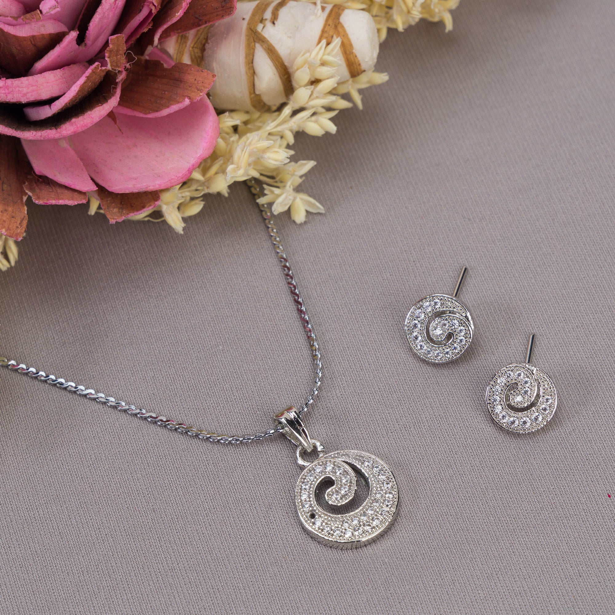 "Rosegold zircon pendant set in round shape, perfect for office wear, adding elegance to your look."
