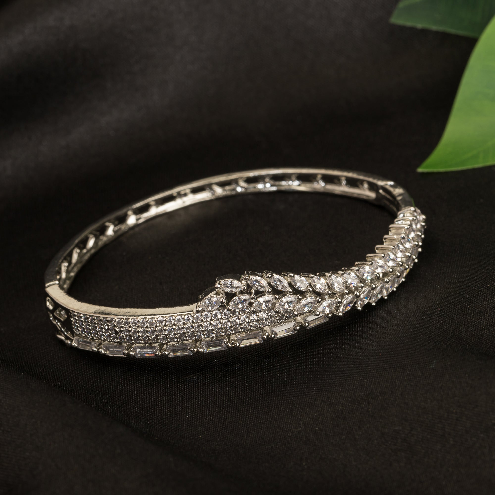 "Silver zircon bracelet with a flower design, perfect for party wear, adding elegance and charm."
