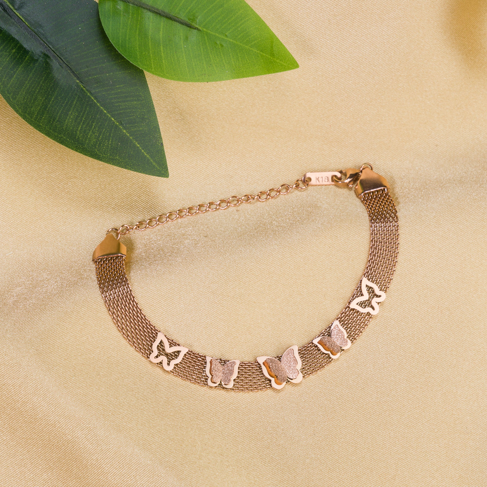 "Rosegold stainless steel bracelet with butterfly details, perfect for casual wear, adding a delicate touch."
