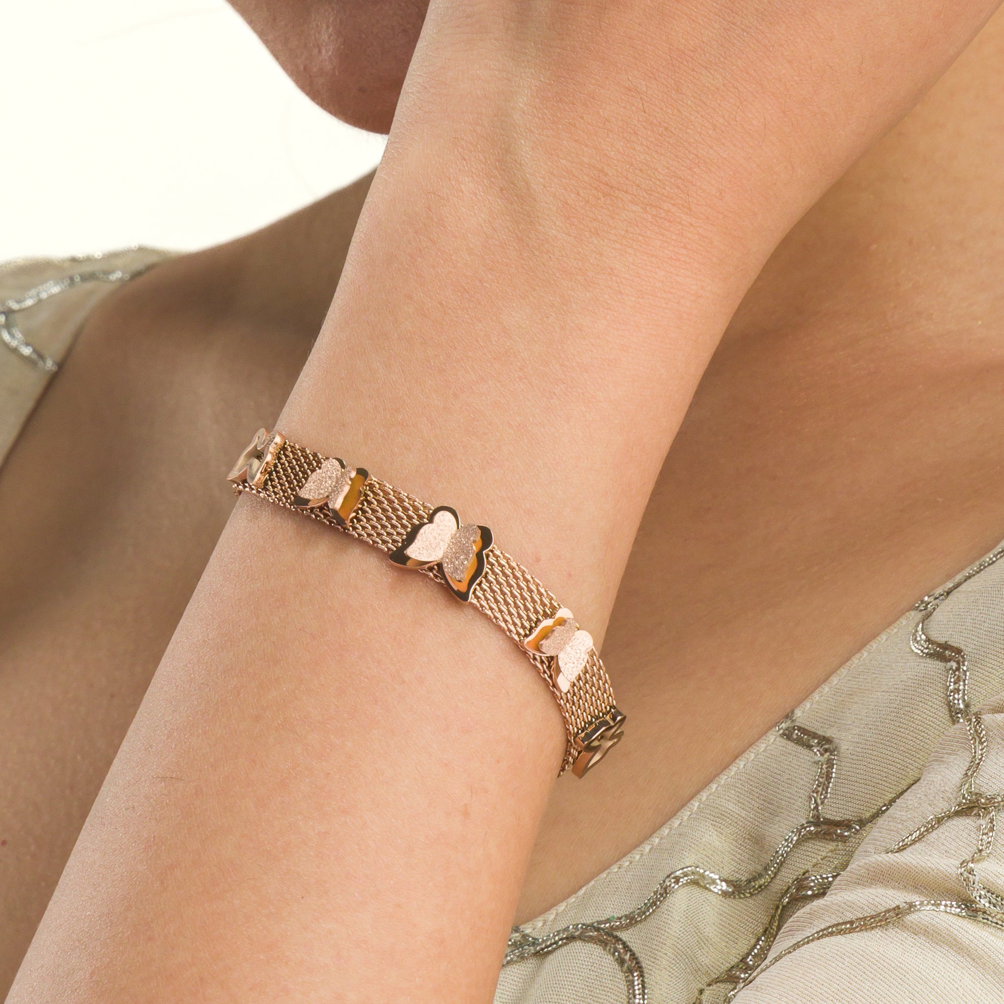 "Rosegold stainless steel bracelet with butterfly details, perfect for casual wear, adding a delicate touch."
