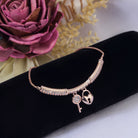 "Trendy lock and key zircon bracelet in rosegold, ideal for party wear, offering a chic and stylish look."
