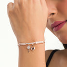 "Trendy lock and key zircon bracelet in rosegold, ideal for party wear, offering a chic and stylish look."
