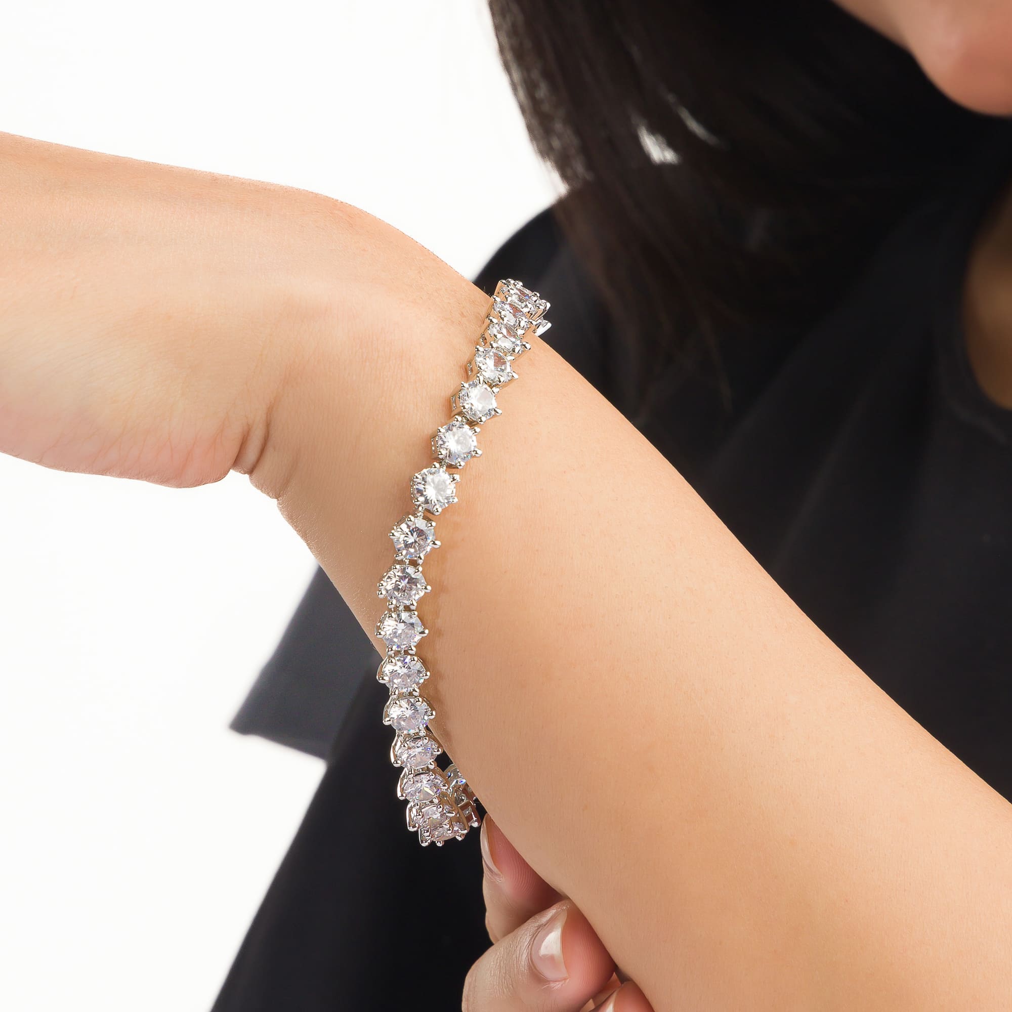 Stunning zircon stone chain bracelet in silver, perfect for party wear, adding sparkle and elegance."
