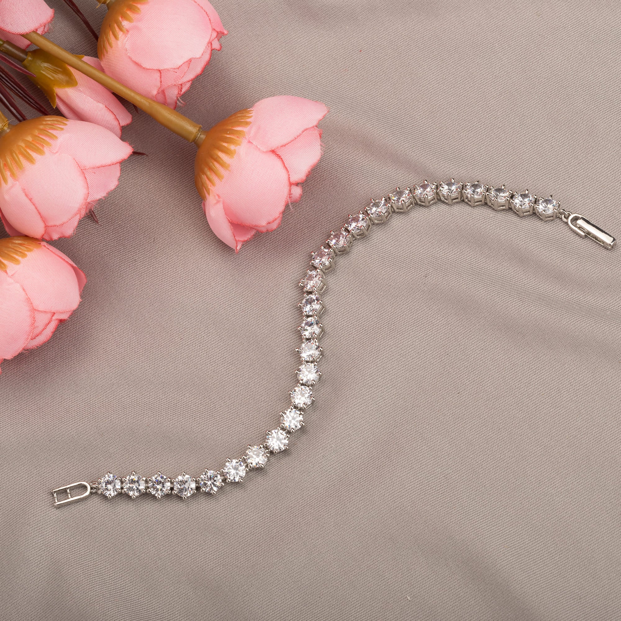 Stunning zircon stone chain bracelet in silver, perfect for party wear, adding sparkle and elegance."
