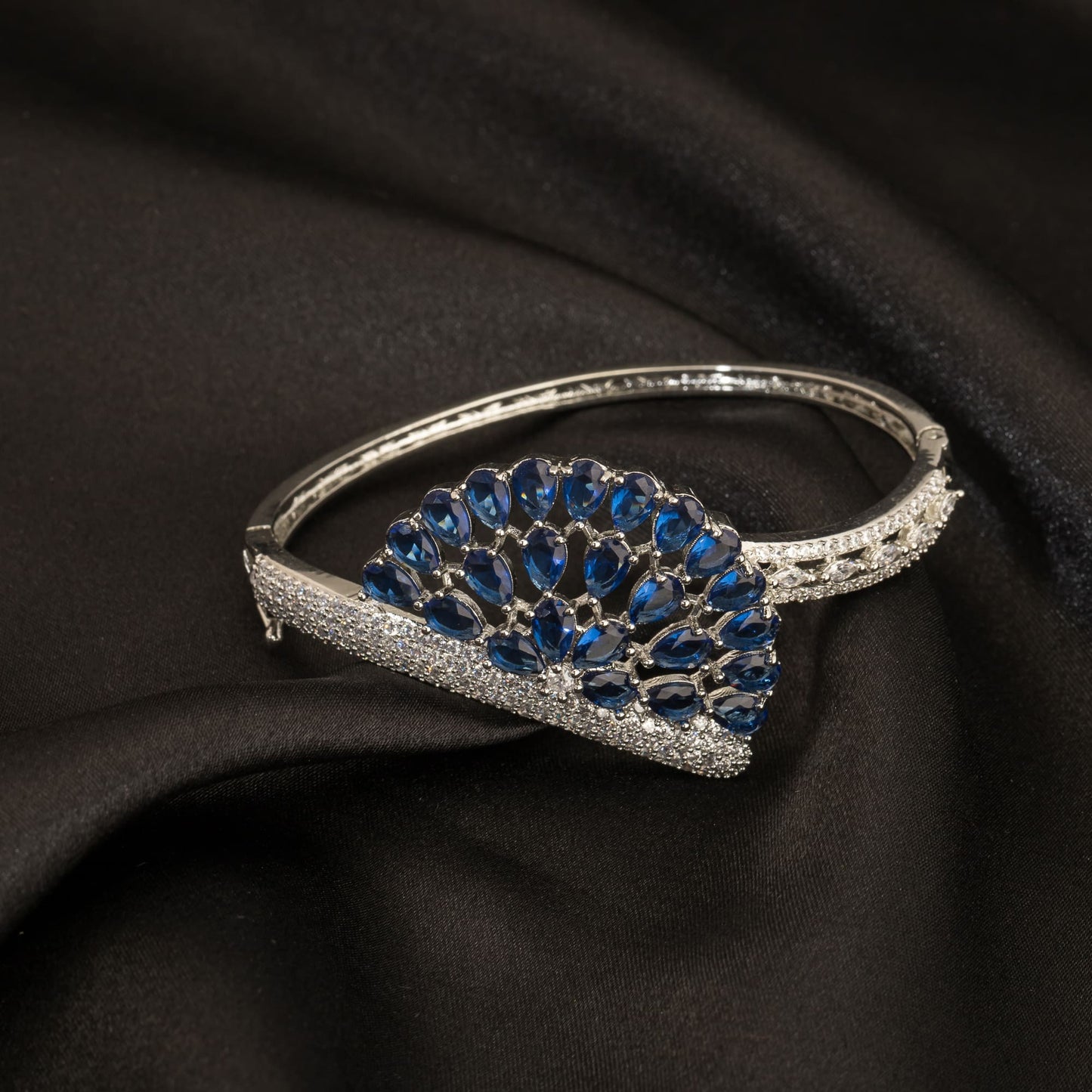 A BLUE ZIRCON BRACELET RADIATES WITH A DEEP, CAPTIVATING AZURE BRILLIANCE