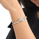 "Brilliant zircon bracelet in silver, showcasing dazzling clarity and gem-like radiance, ideal for party wear."
