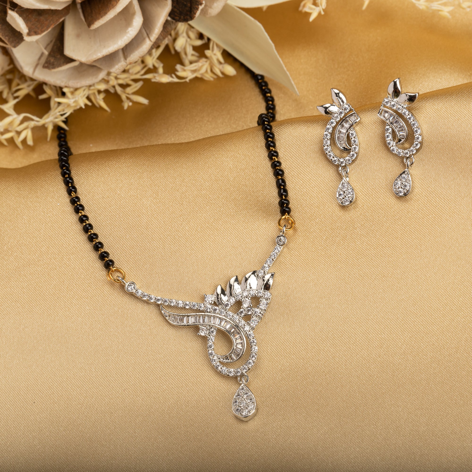 "Black zircon mangalsutra in silver, an auspicious symbol worn by brides for marital life."
