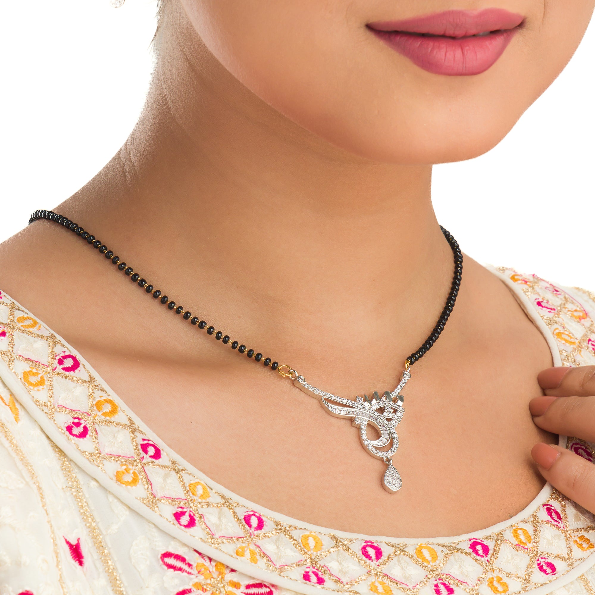 "Black zircon mangalsutra in silver, an auspicious symbol worn by brides for marital life."
