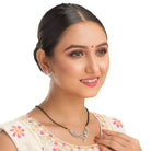 "Zircon mangalsutra in black and gold, blending traditional charm with radiant, modern sparkle."
