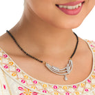 "Zircon mangalsutra in black and gold, blending traditional charm with radiant, modern sparkle."
